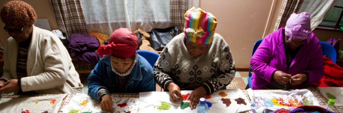 Brightly coloured beads, lovingly threaded by unemployed gogos (grandmothers) and township residents